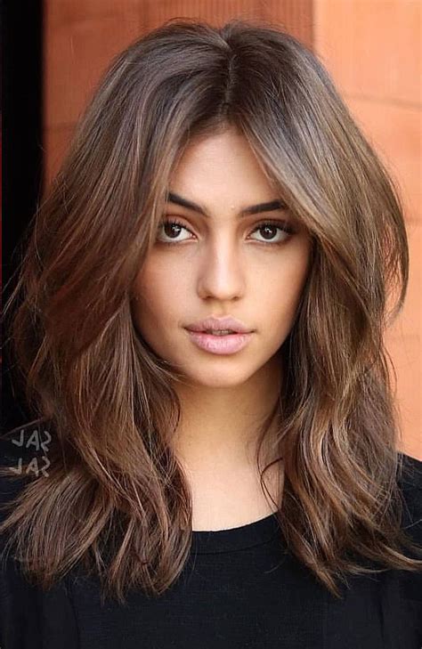 Layered haircuts are one of the most popular types of hair today because they give volume and texture even to the sleekest hair. 2020 Popular Voluminous Layers Under Bangs Hairstyles