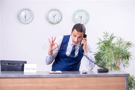 Young Man Receptionist At The Hotel Counter Stock Photo Image Of Male