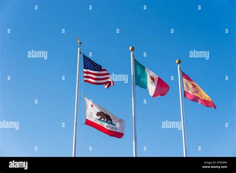 American Mexico And California State Flags Waving In The Air Stock