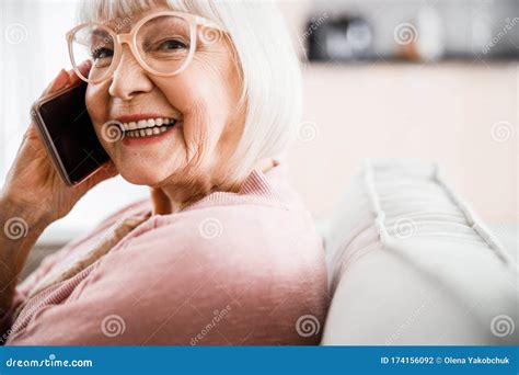 Cheerful Old Lady In Glasses Talking On Cellphone Stock Photo Image