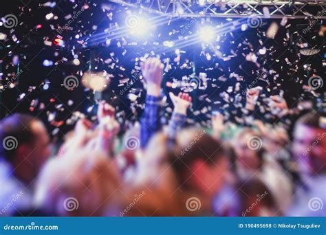 Colourful Confetti Explosion Fired On Dance Floor Air During A Concert
