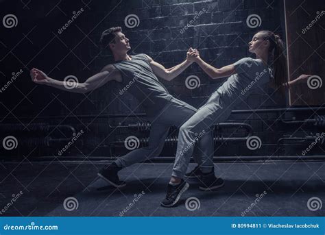 Involved Dancers Warming Up In Close Interaction With Each Other Stock