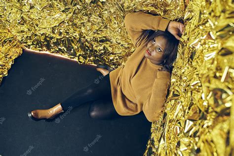 Premium Photo African American Woman Sitting On The Floor With Her