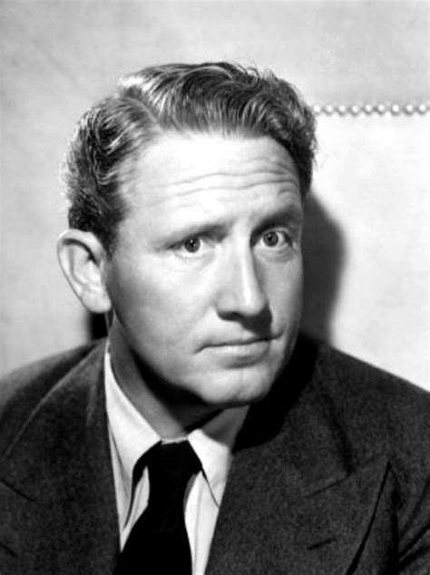 An Old Black And White Photo Of A Man In A Suit Looking At The Camera
