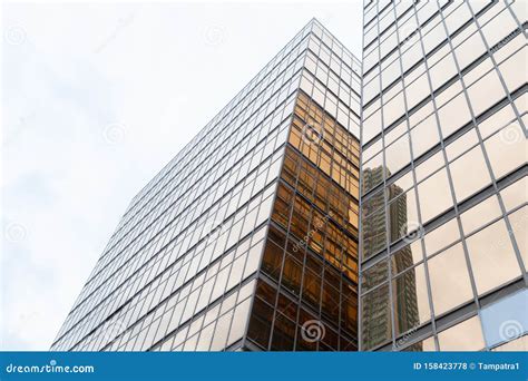 Golden Building Windows Glass Of Modern Office Skyscrapers In