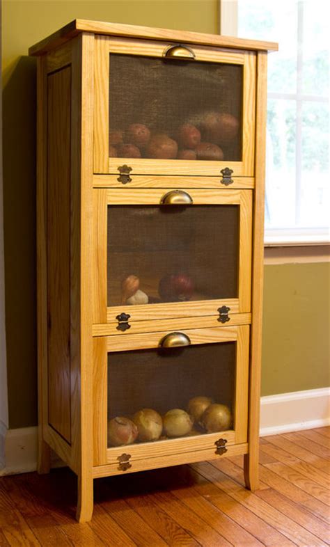 These easy to build onion and potato bins are low profile, so can fit in your kitchen, a blank wall in your pantry or used throughout the home for storage. Potato and Onion Bin - by MarkJ @ LumberJocks.com ~ woodworking community