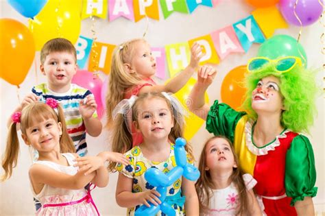Jolly Kids With Clown Celebrating Birthday Party Stock Photo Image Of