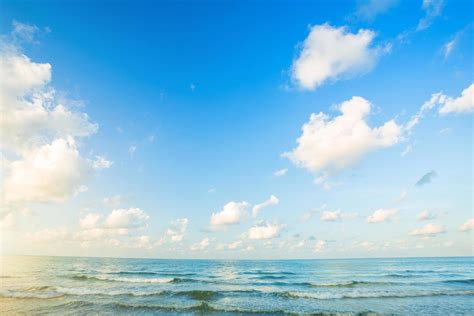 Download Blue Gradient Horizon With Cottony Clouds Wallpaper