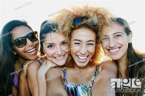 Smiling Women Taking Selfie Together Outdoors Stock Photo Picture And
