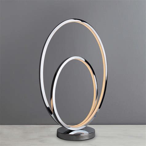 It features a stunning rose gold finish and marbleized white shades with spiraled cut glass to complete the timeless look. Menton Chrome Infinity LED Table Lamp | Dunelm | Led table ...