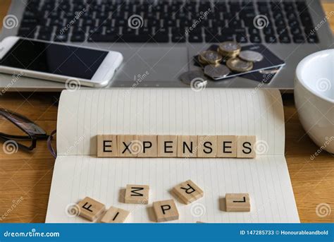 Concept Keyword Expenses In Wooden Tile Letters In Personal Home Desk