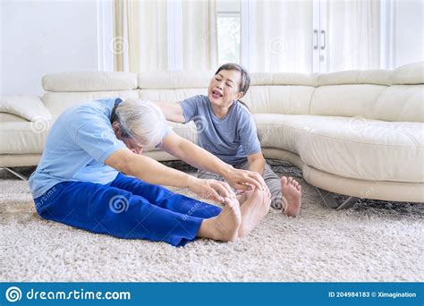 Old Man Teaching His Wife To Doing Stretch Exercise Stock Image Image