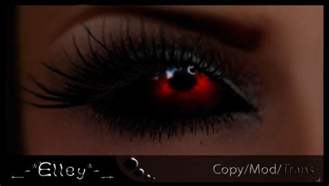 A Womans Eye With Long Lashes And Red Light Reflected In The