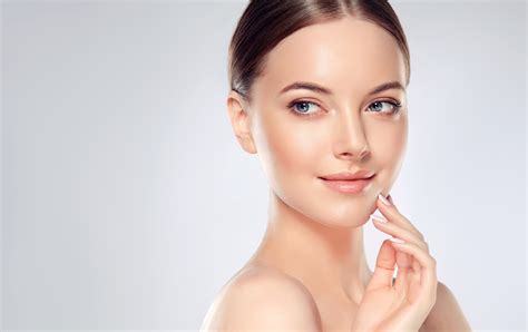 Beautiful Young Woman With Clean Fresh Skin Touch Own Face Facial