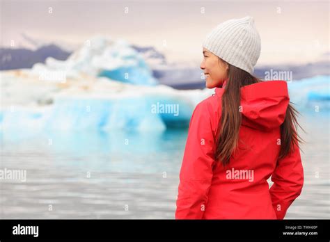Woman At Glacier Lagoon On Iceland Happy Tourist Woman Looking Enjoying View Of Jokulsarlon