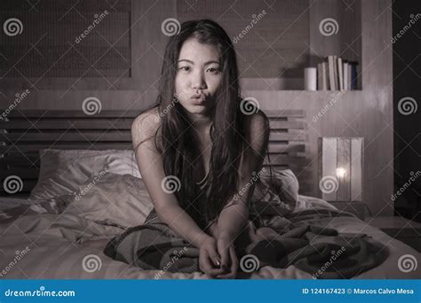 Beautiful And Happy Asian Chinese Woman Lying In Bed At Home Bedroom Smiling Cheerful And