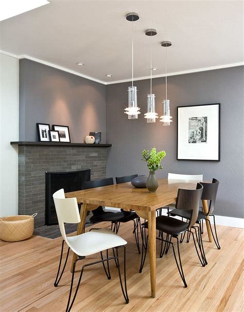 The walls aren't broken up by different finishes, so the uninterrupted flow of grey paint plays with the proportions of the room, creating the illusion of more space and an airy, open room. 25 Elegant and Exquisite Gray Dining Room Ideas
