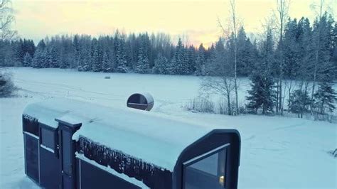 Trailer And Sauna By A Frozen Lake And Frosty Forest In The Countryside