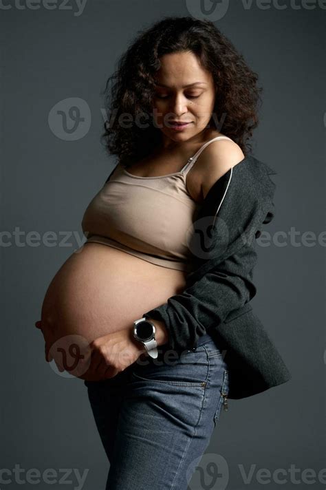 Curly Haired Latin American Pregnant Woman Expectant Mother Touching