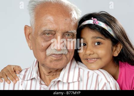 South Asian Indian Grandfather And Granddaughter Looking At Camera Mr Stock Photo Alamy