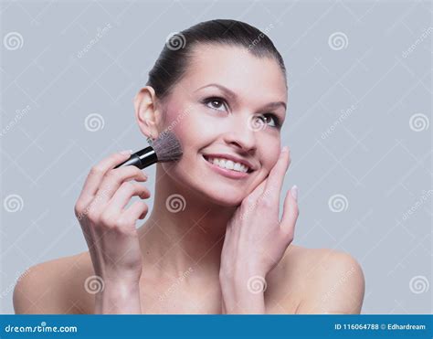 Woman Applying Dry Cosmetic Tonal Foundation On The Face Using M Stock Photo Image Of Gray