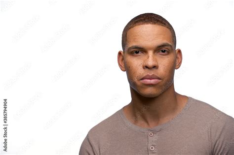 Portrait Of Young Black Man Looking At Camera With Straight Face Stock