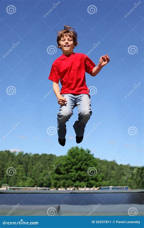 Joyful Boy Jumps On Trampoline Stock Image Image Of Activity Jeans