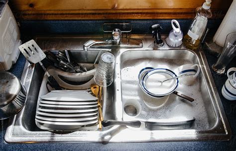 Sink Filled With Dishes And Soapy Water By Cara Dolan