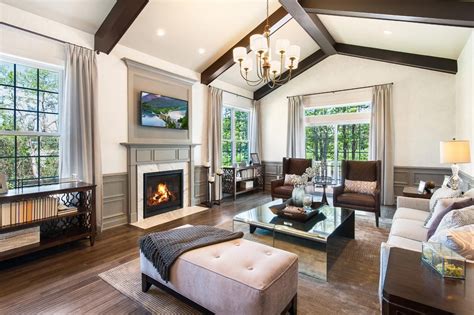 Dramatic Beams And A Vaulted Ceiling Define This Living Room The