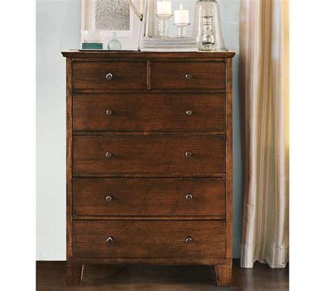 In a guest room, use a modern dresser to collect spare sheets, towels and other linens. Valencia Tall Dresser | Tall dresser, Living room ...