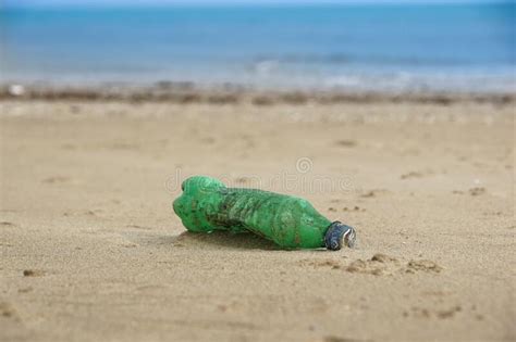 Waste Plastic Bottle On Sand Garbage On The Beach Stock Photo Image