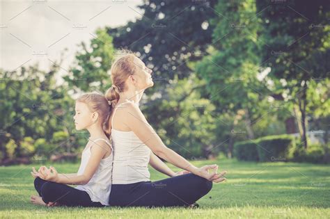 Mother And Daughter Doing Yoga ~ Sports Photos ~ Creative Market