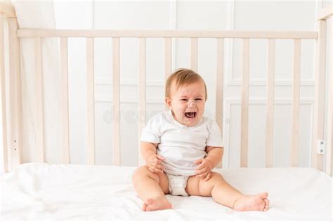Baby Crying Sitting In His Crib At Home Stock Image Image Of Room