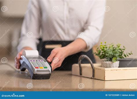 The Waiter Accepts Payment Through The Terminal Contactless Payment