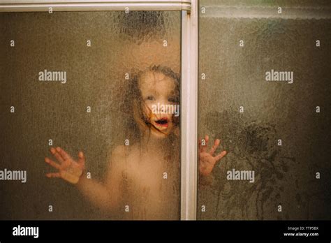 Portrait Of Girl In Shower Seen Through Glass Stock Photo Alamy
