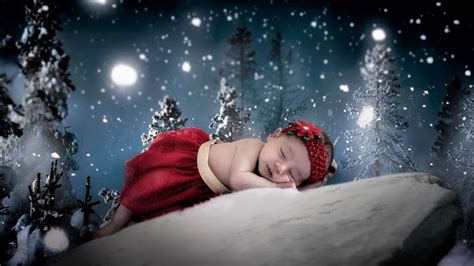 Cute Baby Girl Is Sleeping On Snow Covered Rock With