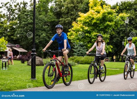 Healthy Lifestyle People Riding Bicycles In City Park Stock Image