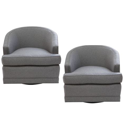Gray swivel barrel soft upholstered velvet chair with golden base. Pair of Grey Flannel, Barrel Back Swivel Chairs at 1stdibs