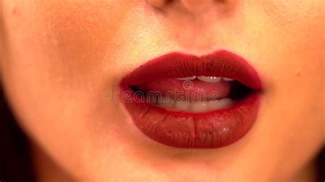 Young Female Licking Her Lips Close Up Shot Of Beautiful Woman Tongue