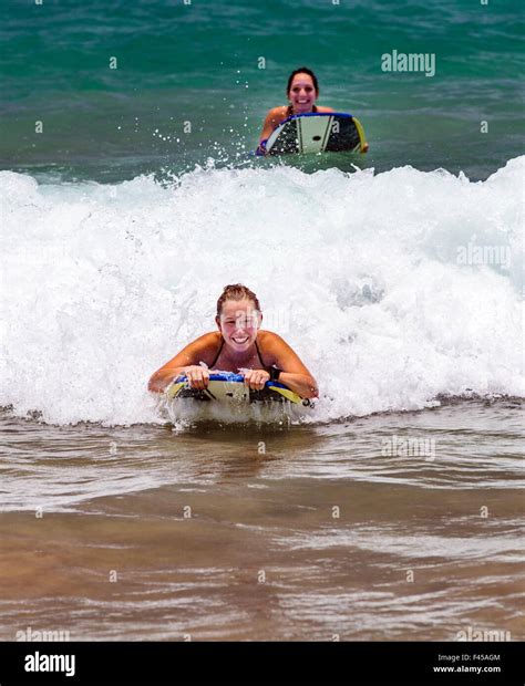 Girls Surfing Waves Hapuna Beach Kohala Coast Hawaii Usa Stock