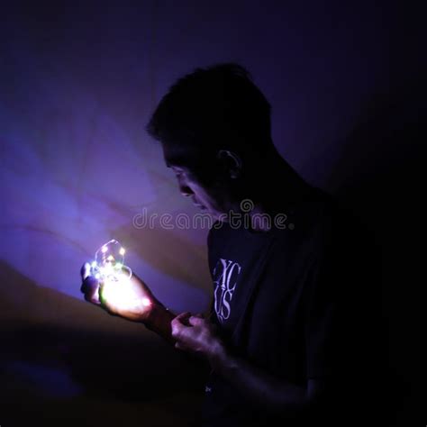 A Person Who Is Holding Light In A Dark Place Stock Image Image Of