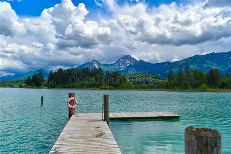 Dock On A Tranquil Lake With Turquoise Water Stock Photo Image Of