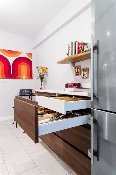 These gorgeous navy cabinets look right at home next to the marble counters, while not overwhelming the limited space this galley style layout provides. A Galley Kitchen Renovation in Jackson Heights, Queens ...