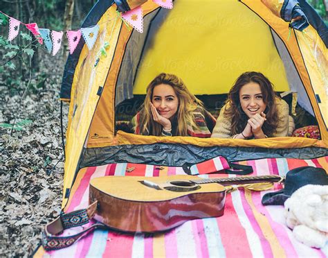 Two Teenage Girls Camping In A Forest By Stocksy Contributor Kkgas Stocksy