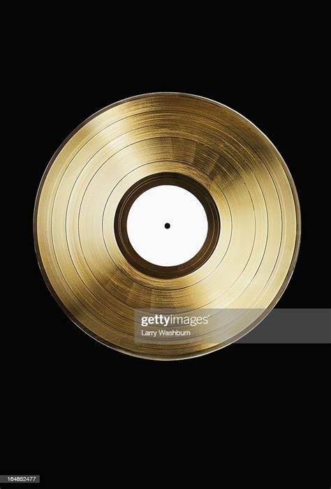 A Gold Record On A Black Background High-Res Stock Photo - Getty Images