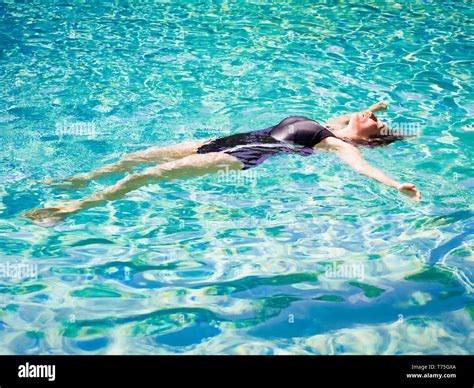 Woman Lying On Her Back Clear Water At Tropical Beach Beautiful Mature Girl Lying And Enjoying