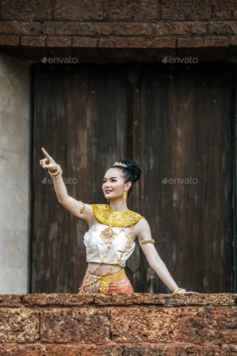 Charming Thai Woman In Beautiful Traditional Dress At Archaeological