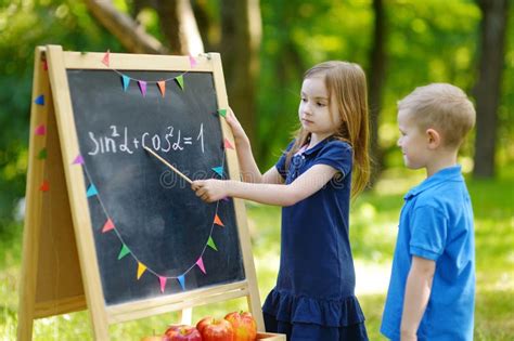 Adorable Little Girl Playing A Teacher Stock Photo Image Of Early
