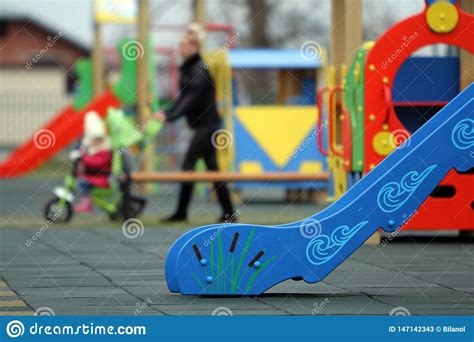 Bright Colorful Slides On Nursery Playground With Soft Rubber Flooring