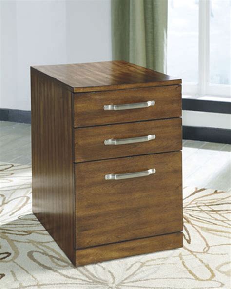 An organized filing system not only keeps your desk free of clutter, but it's also a great way to keep your important documents safe. Three-Drawer Contemporary File Cabinet in Warm Brown ...